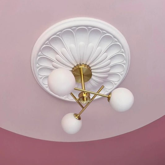 art deco ceiling rose installed in pink room