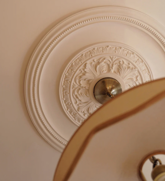 close up victorian ornate plaster ceiling rose