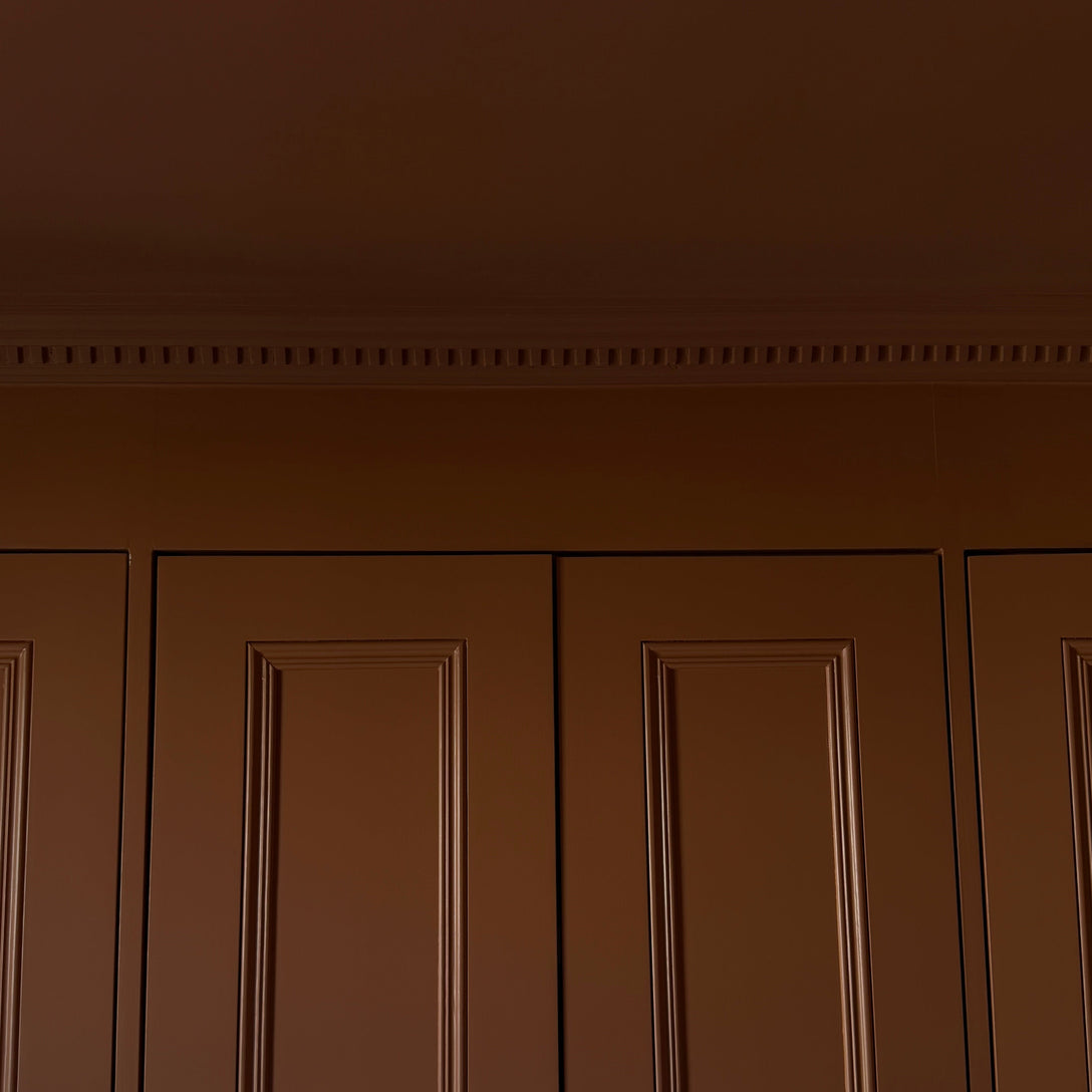 Dentil coving installed in dark room