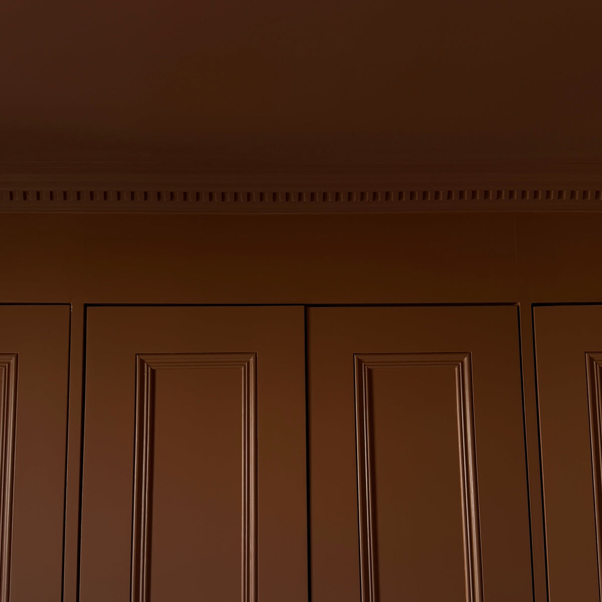 Dentil coving installed in dark room