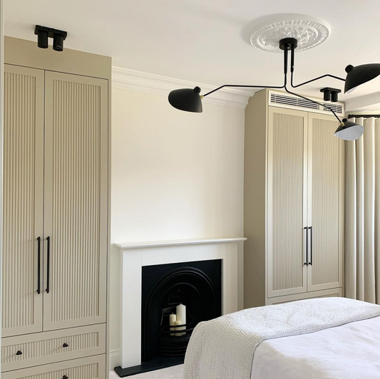 Classic ornate plaster ceiling rose in modern bedroom