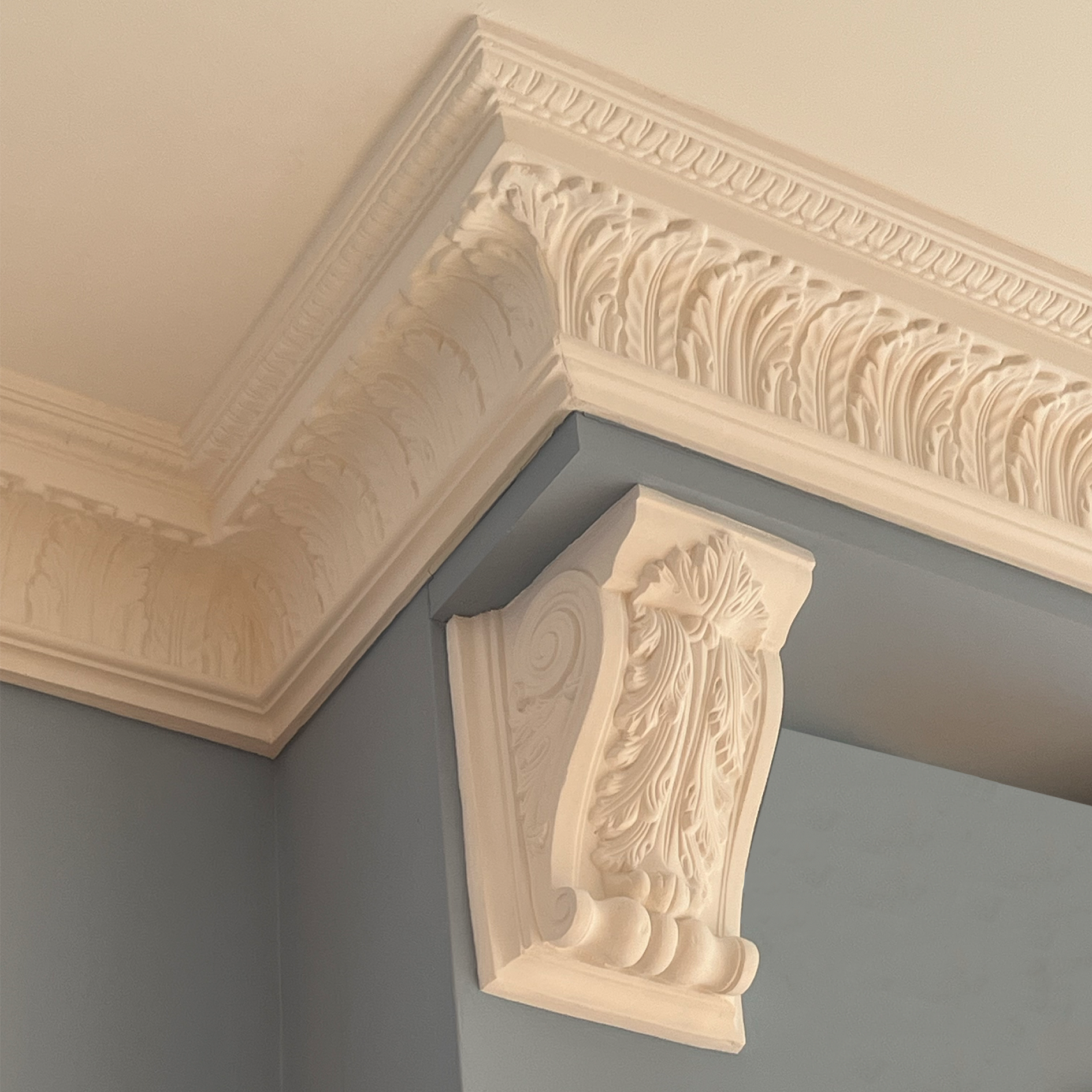 Victorian floral corbel in bright blue room 