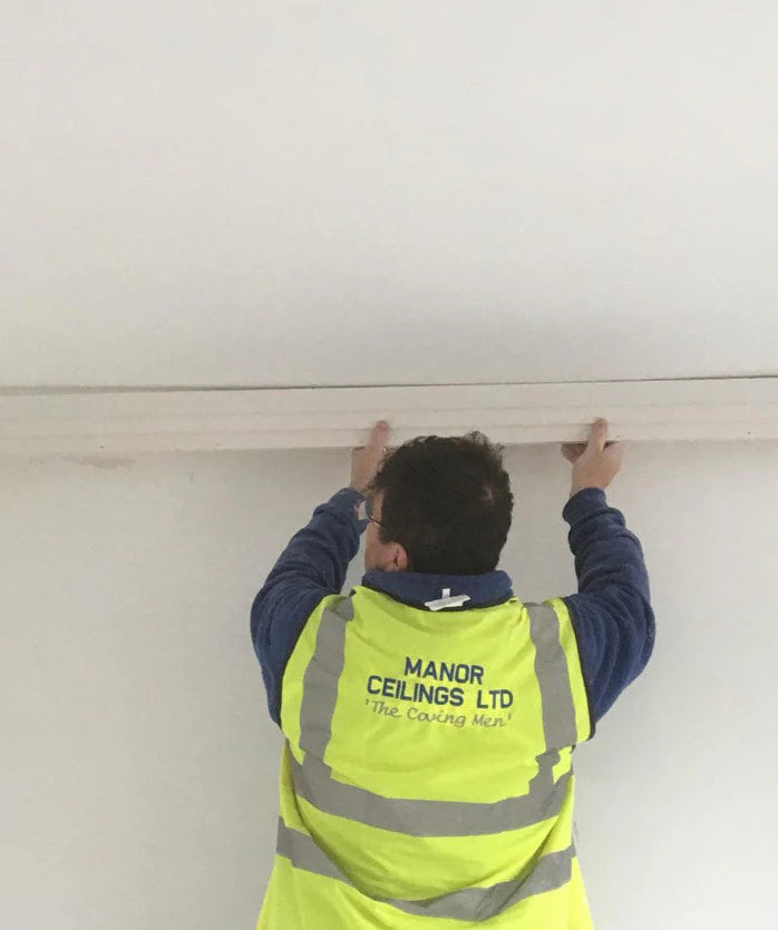 Victorian swan neck plaster coving being installed