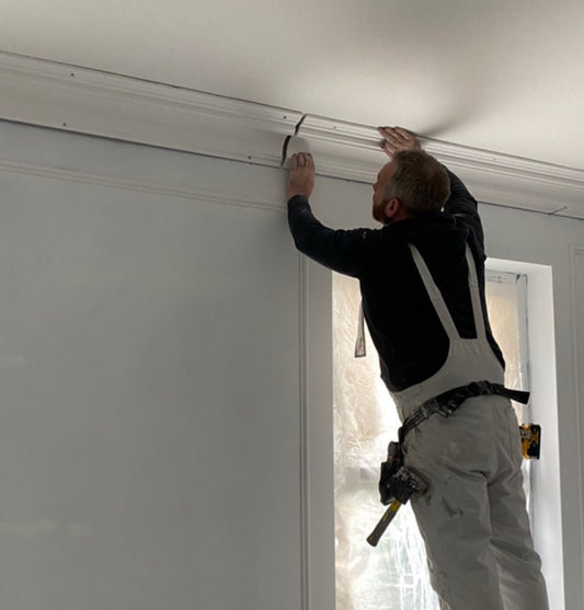 Plaster coving being installed