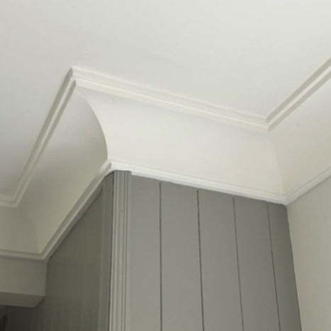 classic victorian plaster cornice on grey wall 