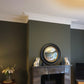 example of london swan neck cornice fitted in a green living room