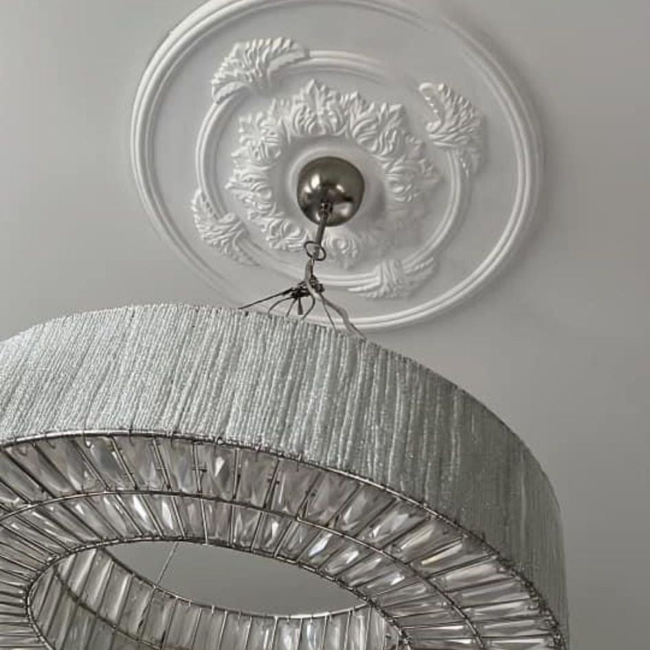 close up image showing details on acanthus satellite plaster ceiling rose - 600mm
