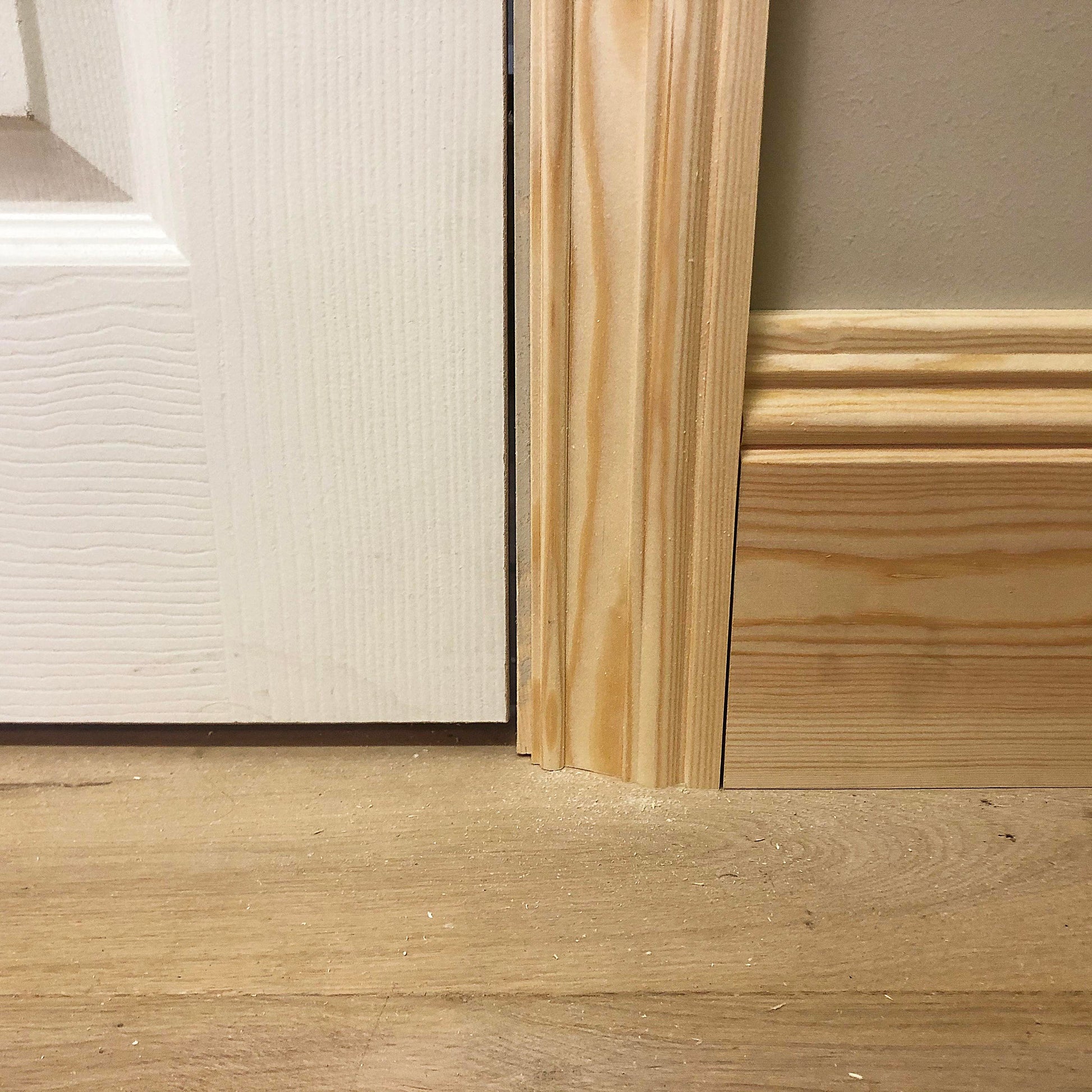 photo of timber victorian architrave joining with skirting board