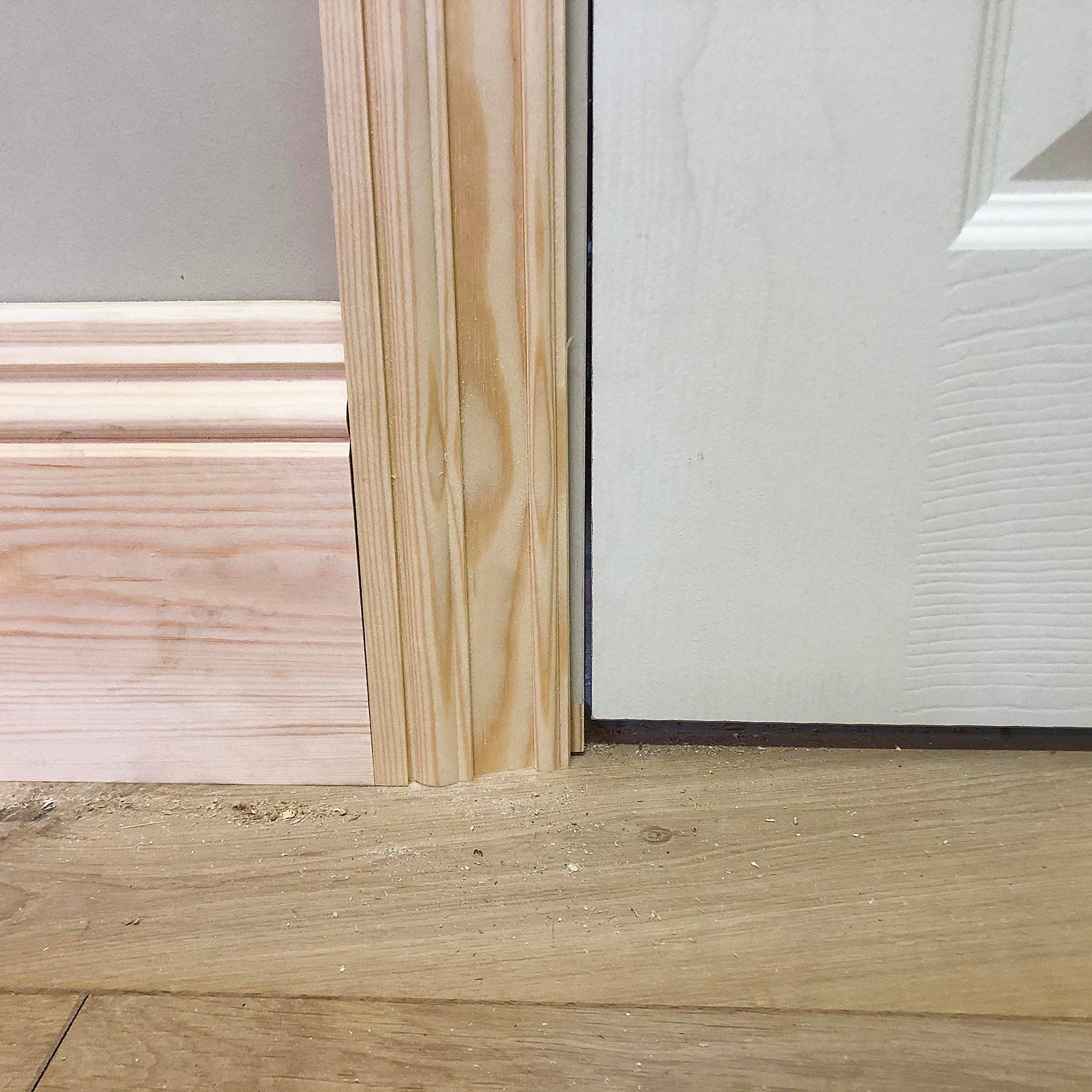 floor section of victorian timber architrave joining with a skirting board