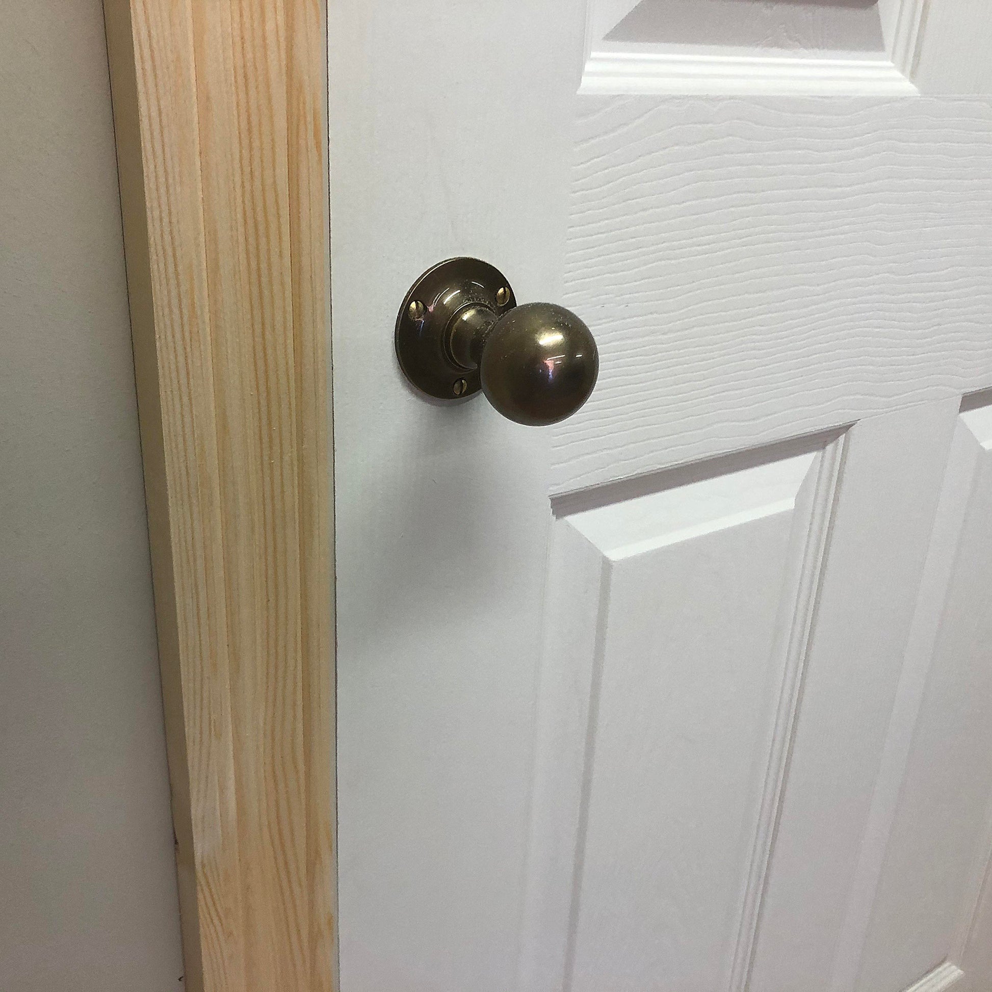 photo of installed timber architrave around a door