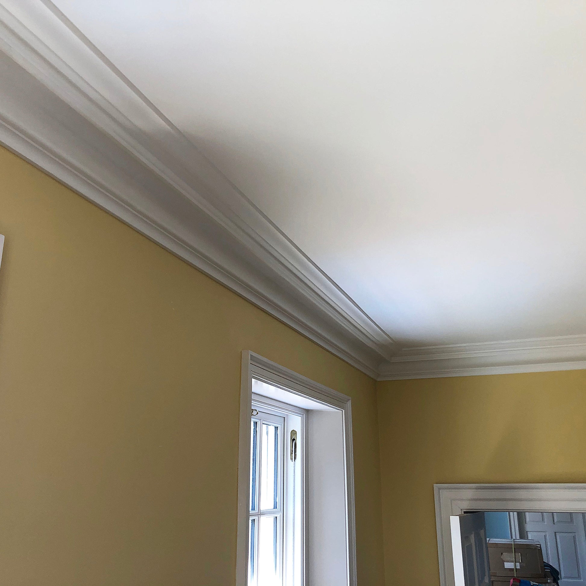 Victorian Swan Neck cornice on yellow wall