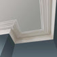 technical image of Victorian Swan Neck Cornice on a blue wall- 130mm