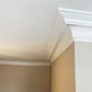 example of Swan Neck Plaster Coving fitted in cream room 125mm 