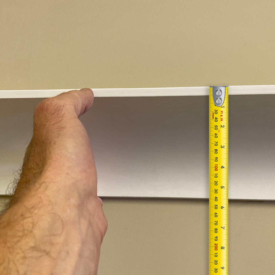 section of Plaster Coving with measuring tape for scale - 100mm Drop