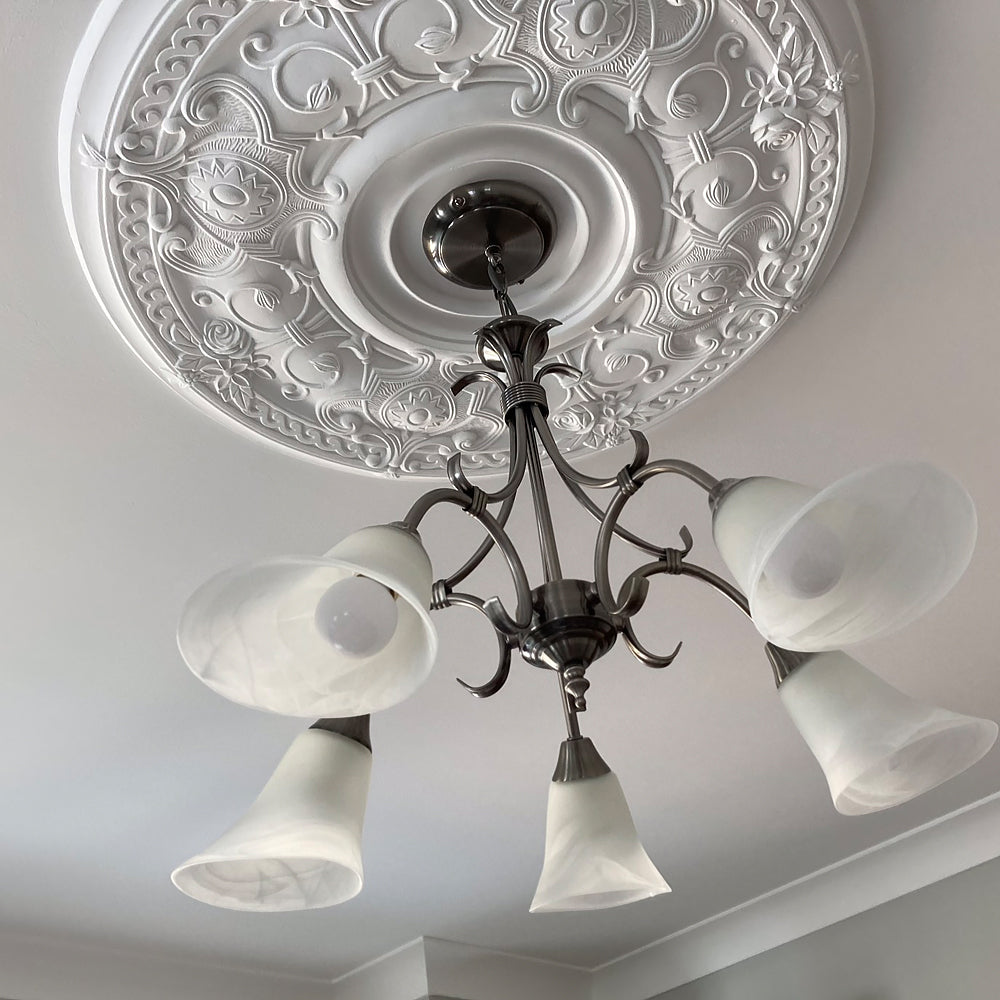 Ornate Victorian Plaster Ceiling Rose in natural lighting