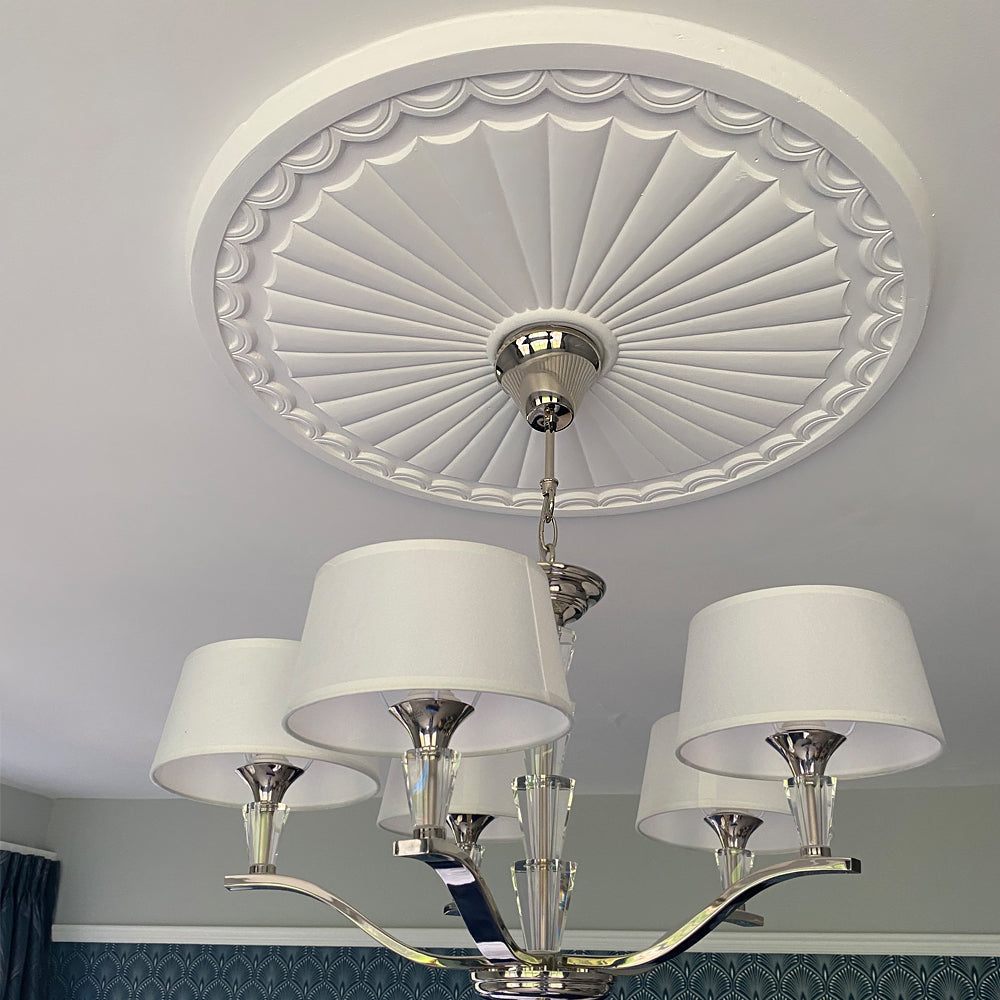 adams sunburst plaster ceiling rose fitted in white room