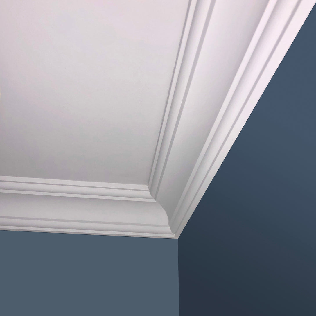 photo of fitted classic plaster coving in blue room