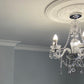 Plaster Coving pictured with a ceiling rose and chandelier - 110mm Drop