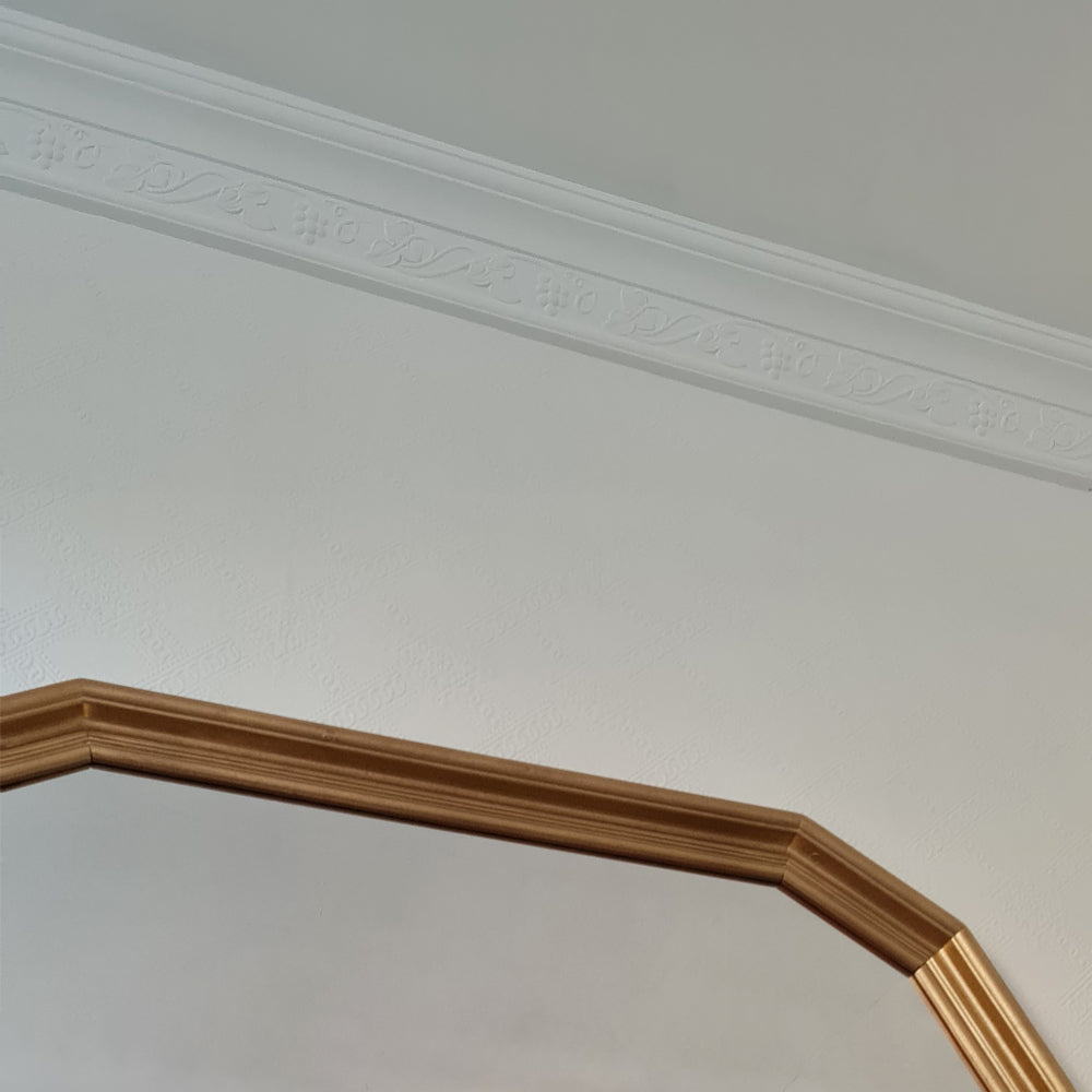 Running Vine cornice above mirror in living room