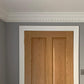 Dentil coving above wooden door