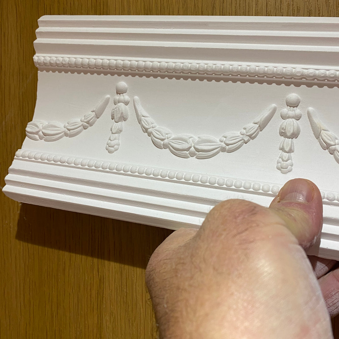 Georgian Swag and Drop coving displayed in-hand