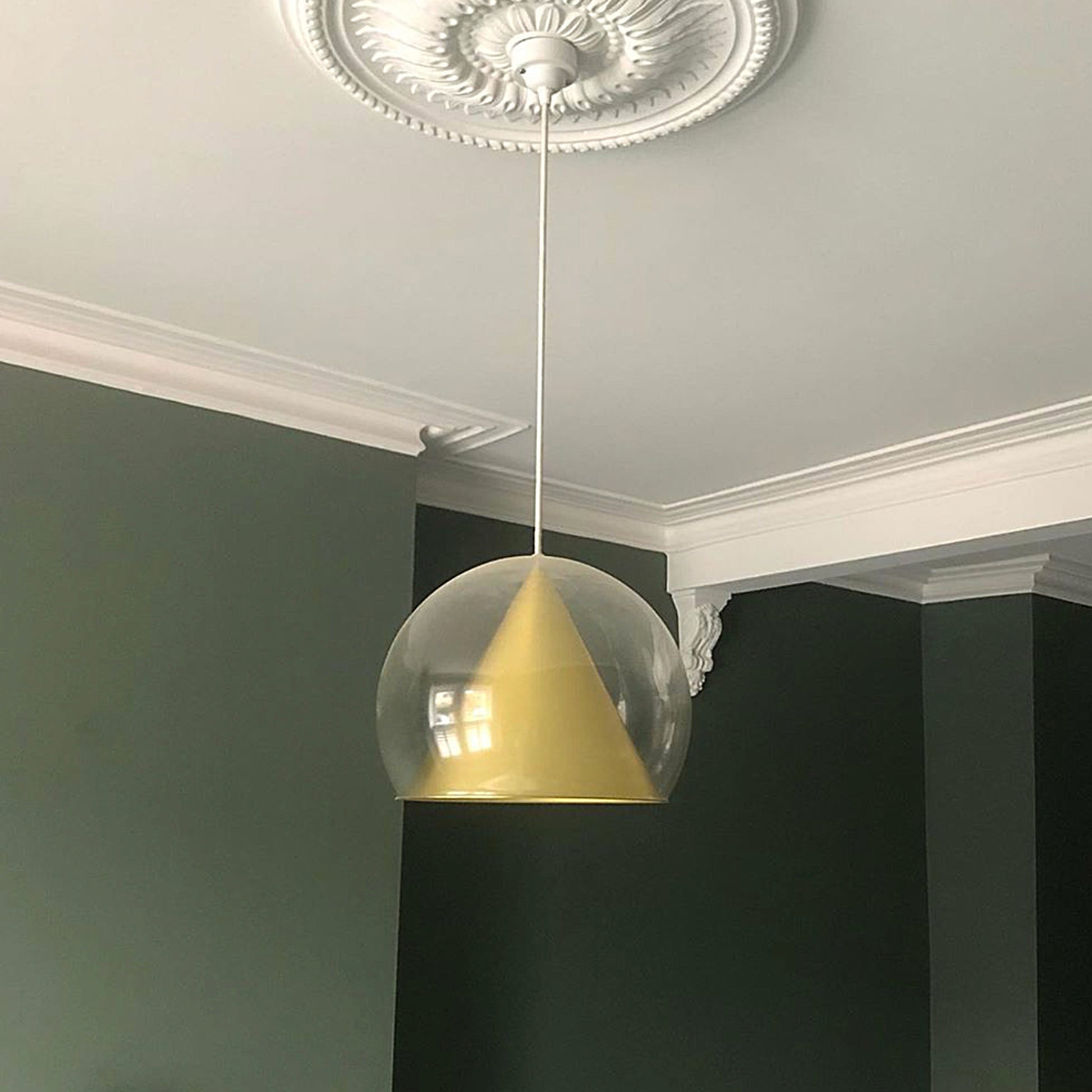 Sunflower Plaster Ceiling Rose in dark green room