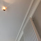 Showing Victorian style Plain Coving on a grey wall- 100MM