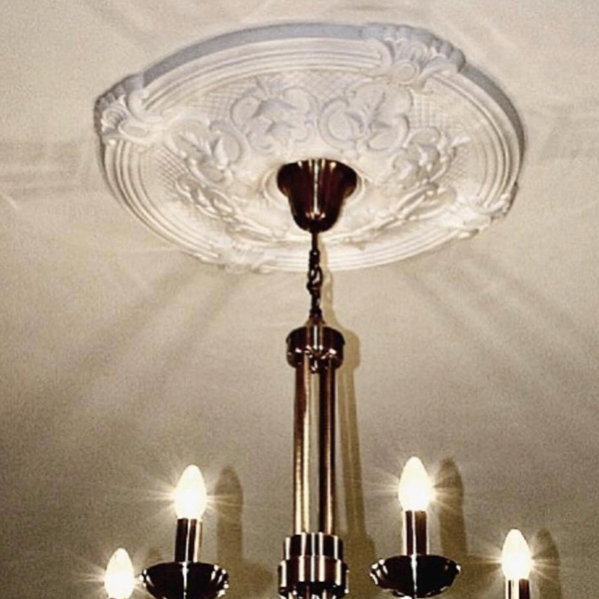 Gothic Plaster Ceiling Rose in warm lighting