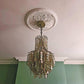 photo showing acanthus plaster ceiling rose fitted with chandelier 510mm