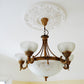 example of Victorian Decorated Plaster Ceiling Rose with vintage chandelier 