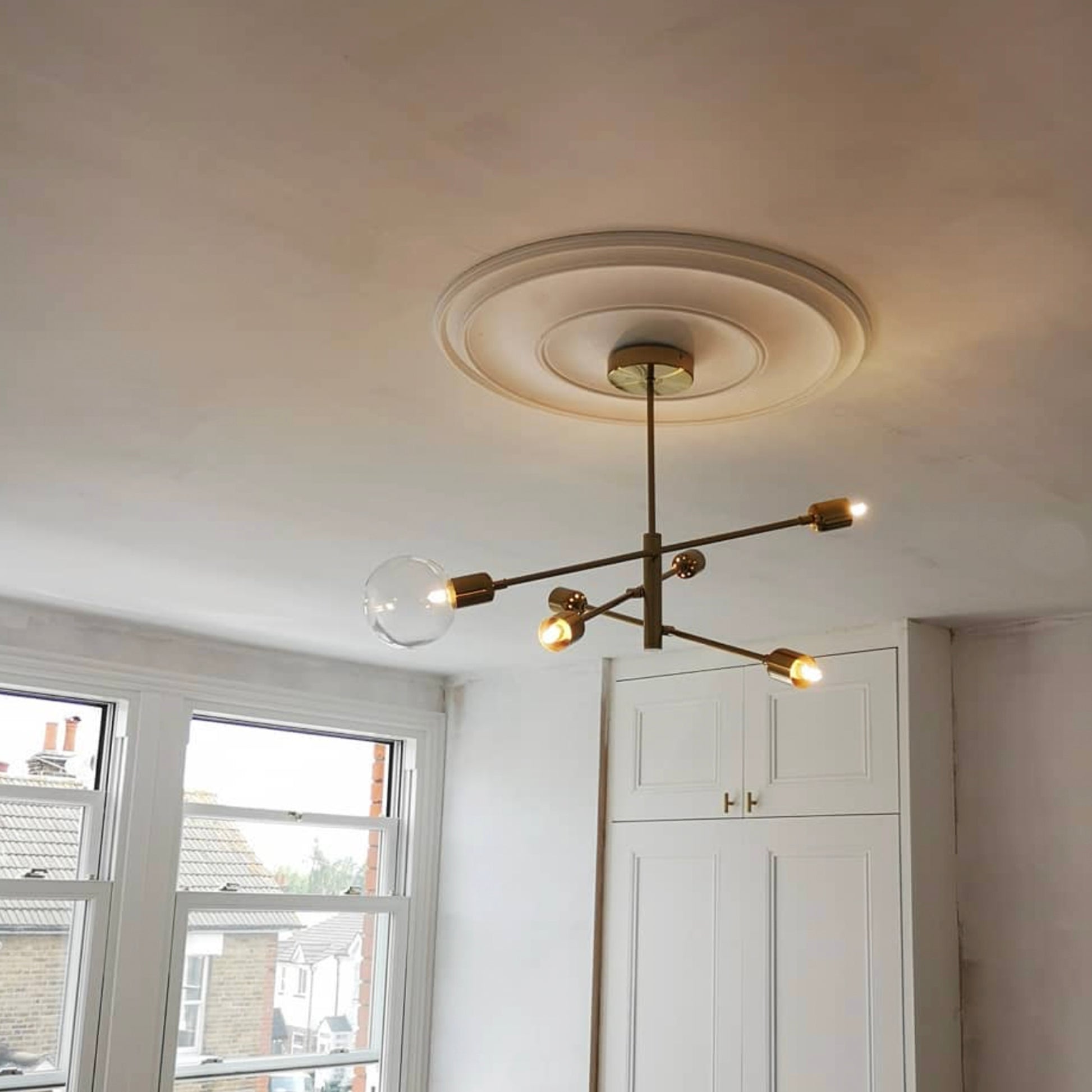 Plain Spun Plaster Ceiling Rose in bright room