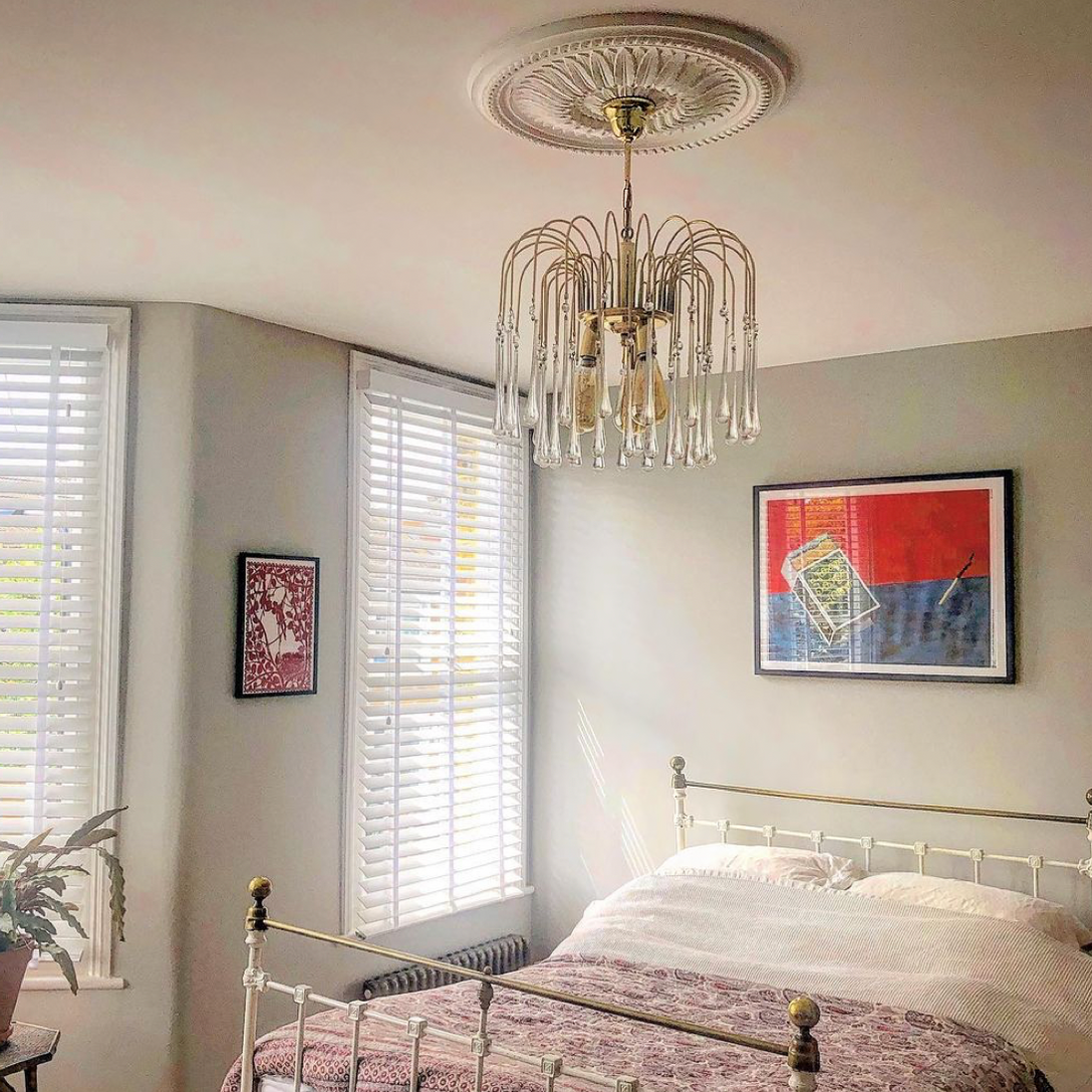 Sunflower Plaster Ceiling Rose in cosy bedroom