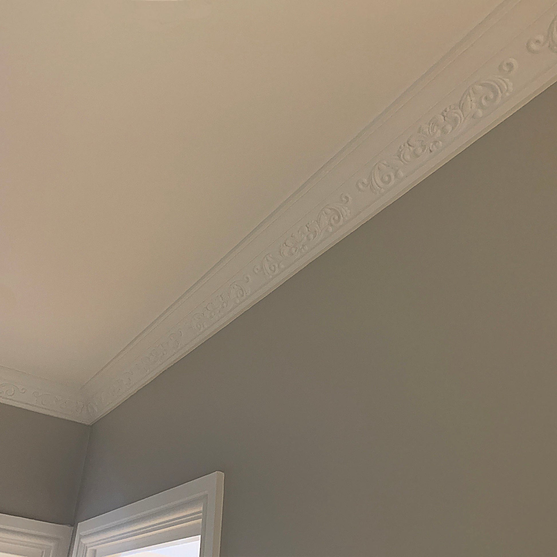 Fleur de Lys plaster cornice on high ceiling