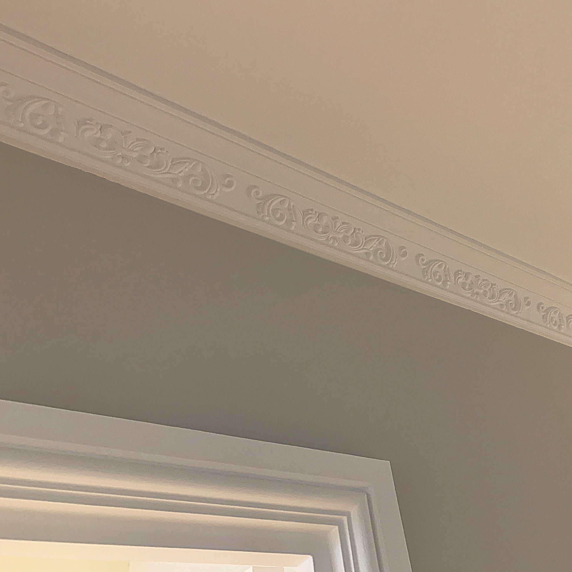 Fleur de Lys cornice above doorway