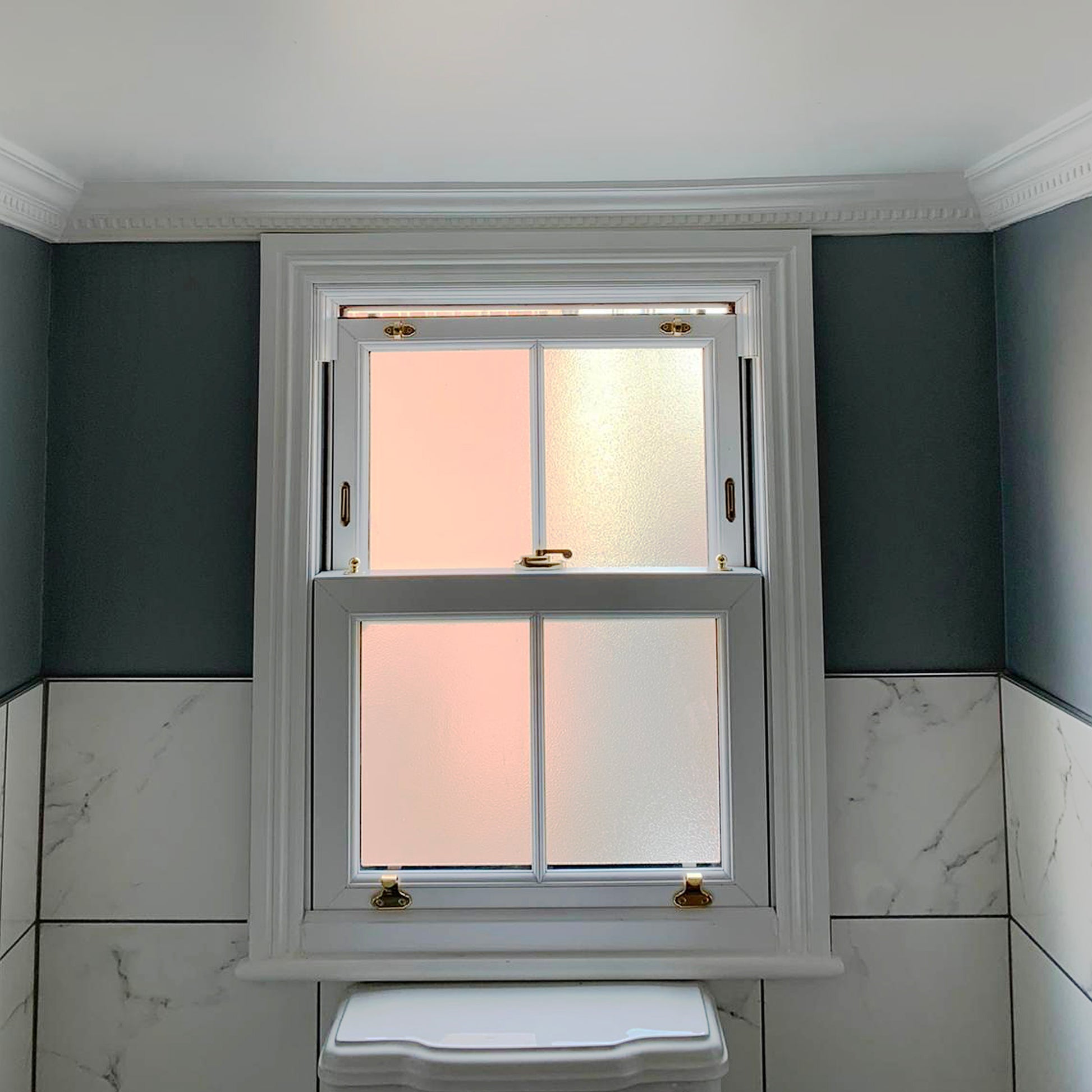 Dentil cornice in bathroom above window