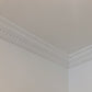 Dentil coving in corner of white walls