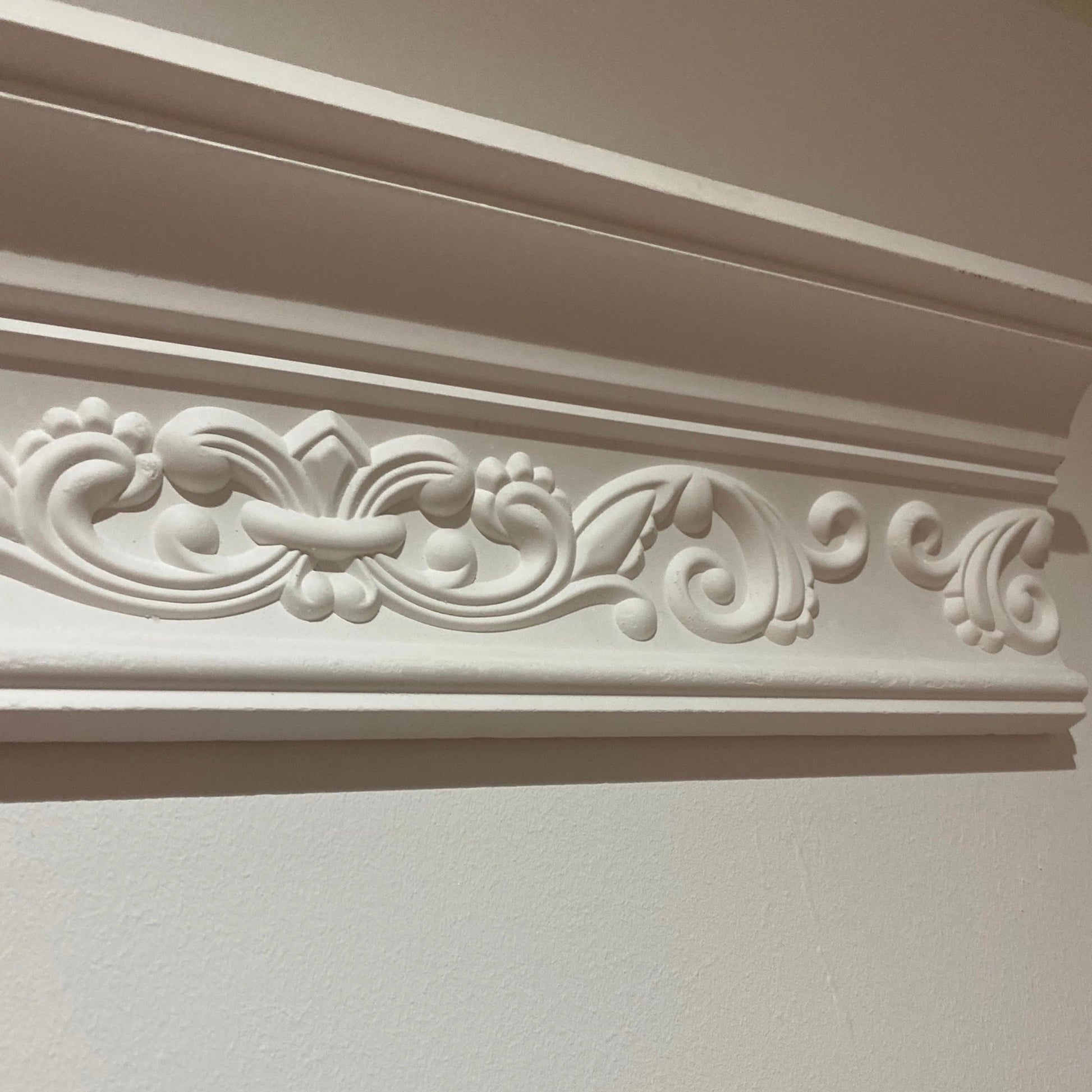 Fleur de Lys cornice details in well-lit room