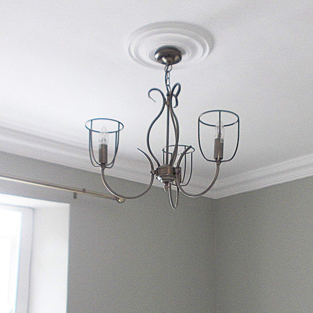 photo shows Plain Spun Plaster Ceiling Rose installed in bright room 320MM 