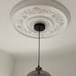 Rose Pattern Plaster Ceiling Rose in naturally lit room