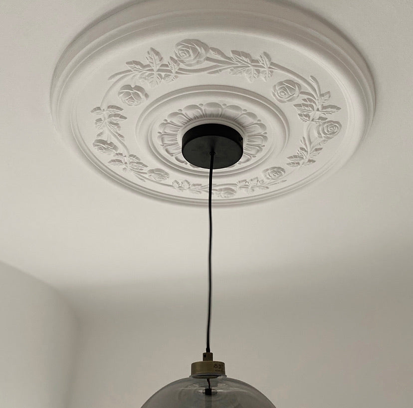 Rose Pattern Plaster Ceiling Rose in naturally lit room