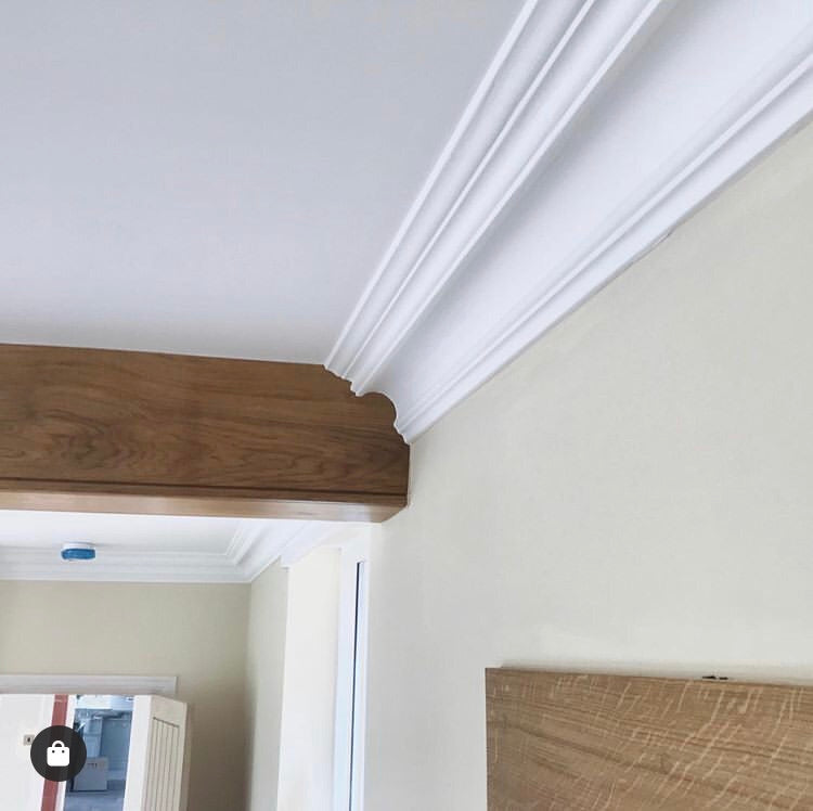 Swan Neck Plaster Coving shown joining with roof beam 125mm 