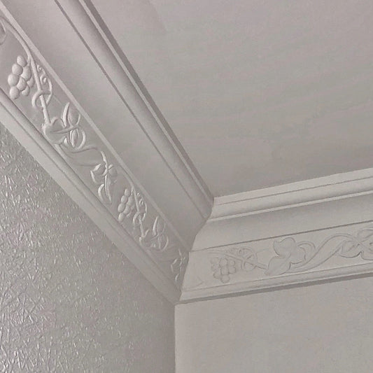 Running Vine cornice in high-ceiling room corner