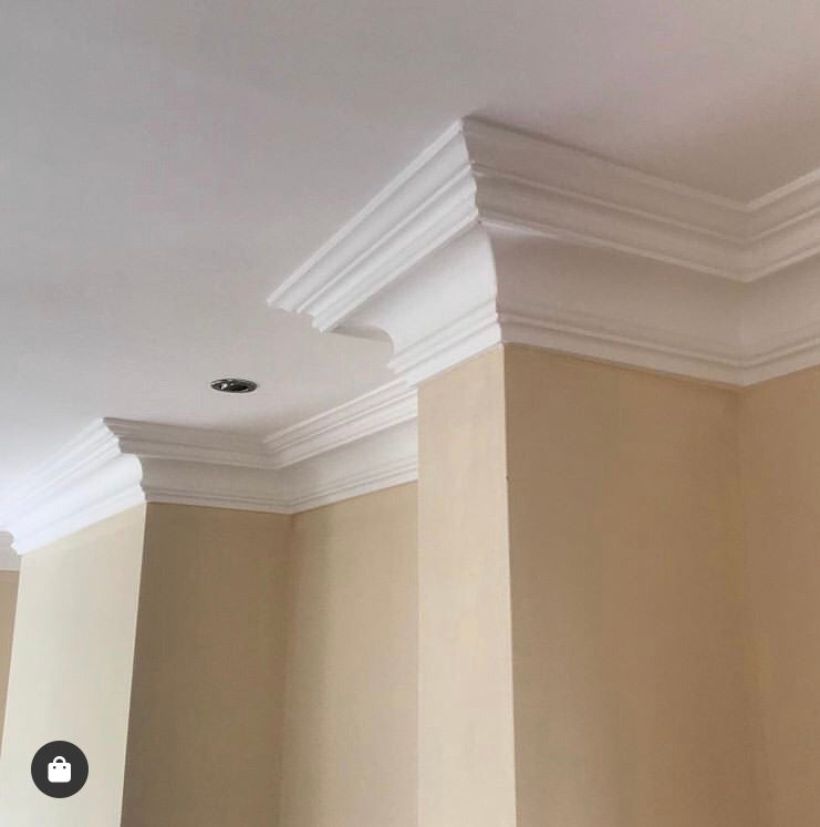 photo shows Swan Neck Plaster Coving installed in cream room 125mm 