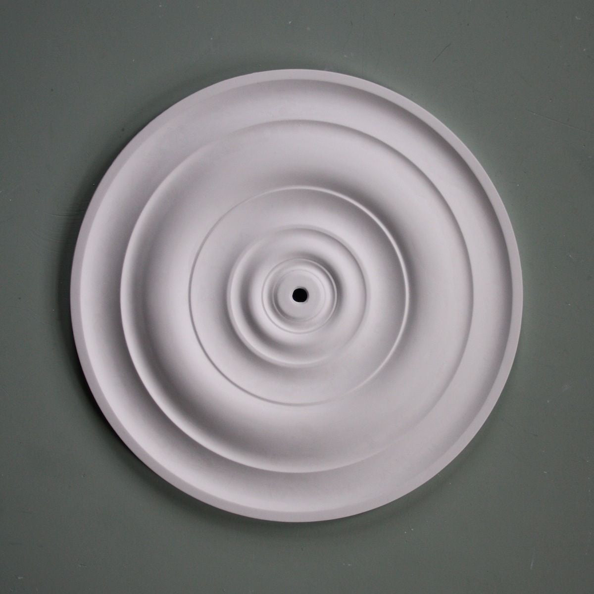 Medium Sized Ceiling Rose against dark ceiling