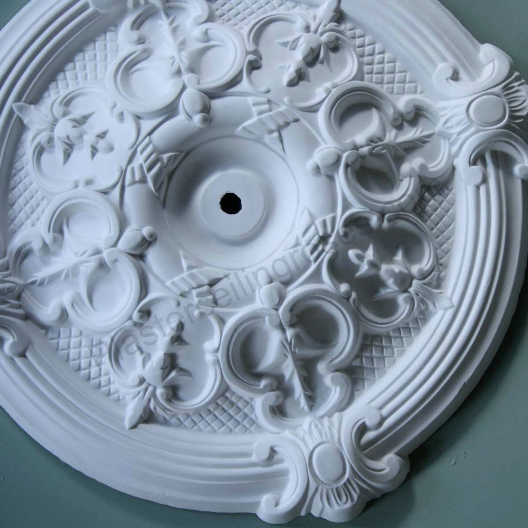 Gothic Plaster Ceiling Rose against dark ceiling